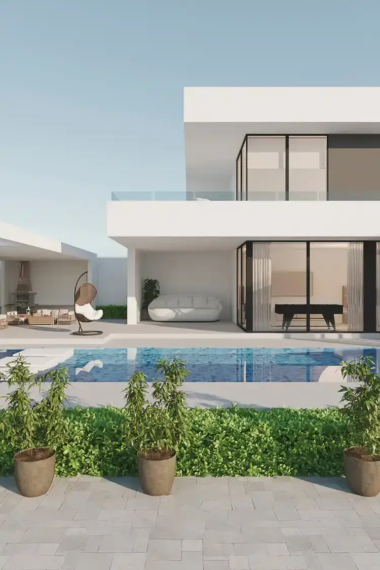 Vista de la fachada posterior y zona de ocio de una residencia de lujo moderna diseñada por Edson Sánchez Arquitecto en Barranquilla. Destaca una piscina de mosaicos azules, terraza pavimentada, setos bajos con tres macetas en primer plano, mobiliario exterior de alta gama (silla columpio, sofá curvo, zona de barbacoa) y vista al interior con una mesa de ping-pong